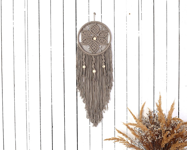 wall hanging in taupe on the white wall made of 3mm macrame cotton rope