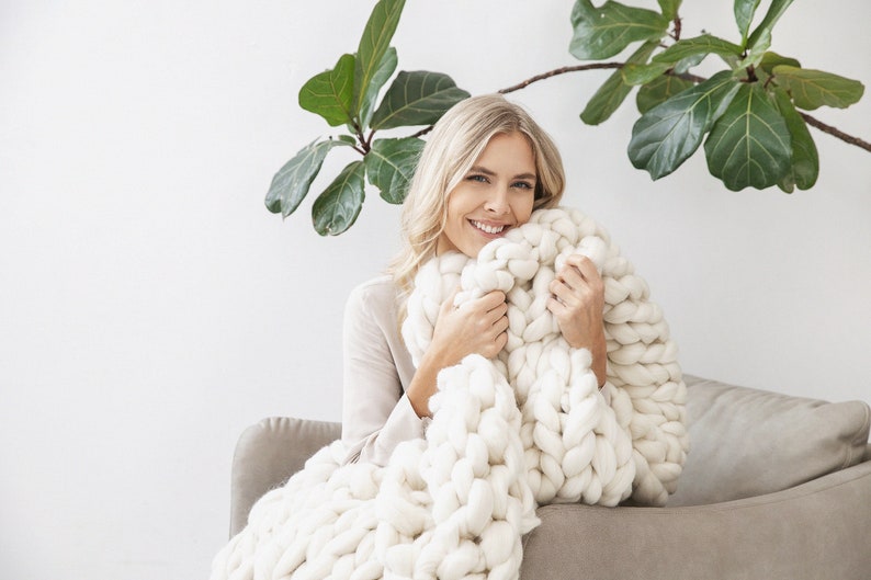 Lady happy with her chunky white merino wool blanket