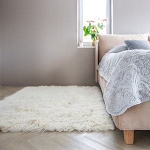 flokati wool rug in bedroom