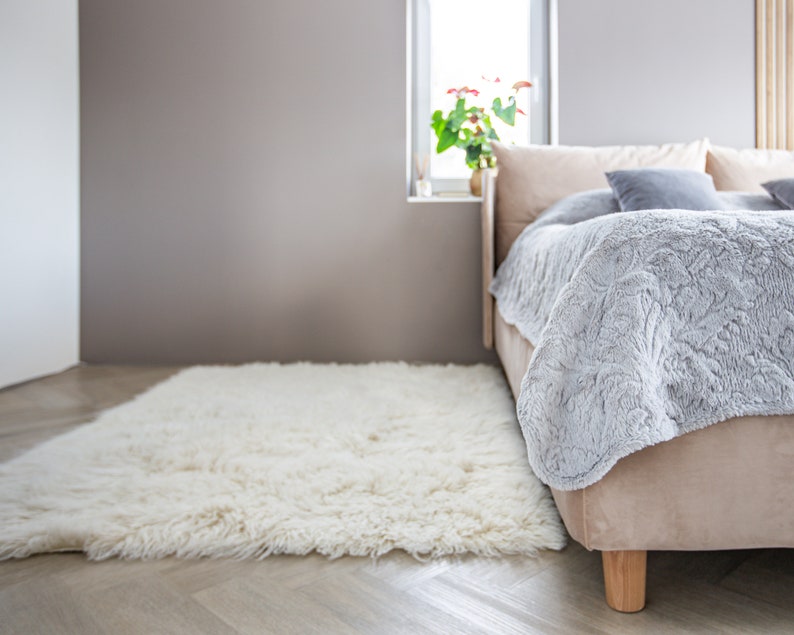 flokati wool rug in bedroom