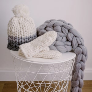 set of mittens scarf and pom pom beanie in white and grey mix