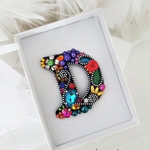 Broche com zíper "D like Dona"