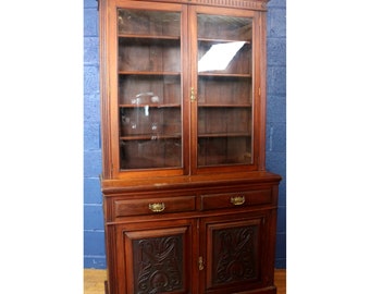 A Large Victorian Carved Walnut Bookcase with Cabinet Base and Fitted with Full Canteen of Cutlery