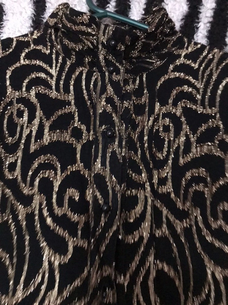 Amazing vintage 1970s 1980s black and gold Sparkle glitter metallic lurex roll high neck blouse.