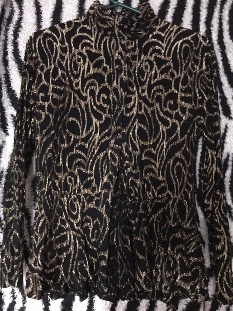 Amazing vintage 1970s 1980s black and gold Sparkle glitter metallic lurex roll high neck blouse.