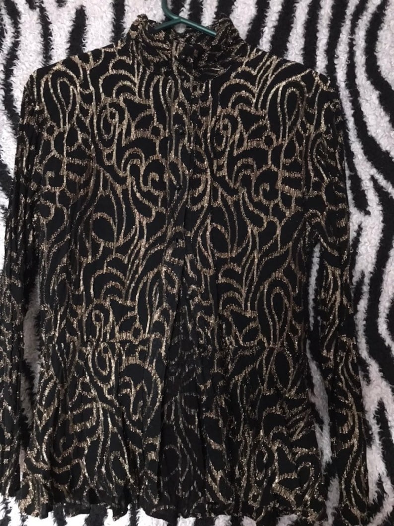 Amazing vintage 1970s 1980s black and gold Sparkle glitter metallic lurex roll high neck blouse.