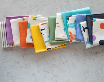 May include: A collection of 10 fabric squares with various patterns and colors, including a blue and white striped fabric, a purple fabric, an orange fabric, a yellow fabric, a green fabric, a white fabric with a blue and white pattern, a white fabric with a red and white pattern, a white fabric with a blue and white pattern, a blue fabric, and a white fabric with a red and blue pattern.