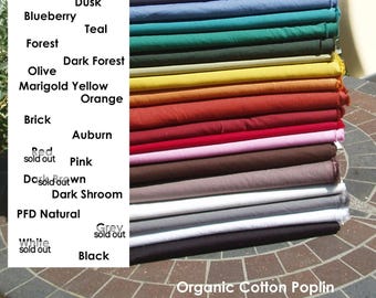 May include: A stack of folded organic cotton poplin fabric in various colors, including twilight, blueberry, forest, olive, marigold yellow, orange, brick, auburn, pink, dark shroom, and black. The text on the image lists the colors and the words "Organic Cotton Poplin".