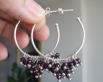 Silver earrings with pyrope type garnet, with large rings and cut beads, root chakra