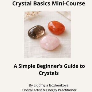 May include: Image of a book cover with the title "Crystal Basics Mini-Course" and the subtitle "A Simple Beginner's Guide to Crystals." The cover features three polished crystals: a brown, an orange, and a pink one.