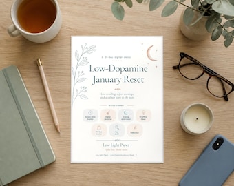 May include: A white planner page titled Low-Dopamine January Reset with botanical line art, a crescent moon, and icons for tracking habits. The text includes A 31-day digital detox, Less scrolling, softer evenings, and a calmer start to the year.