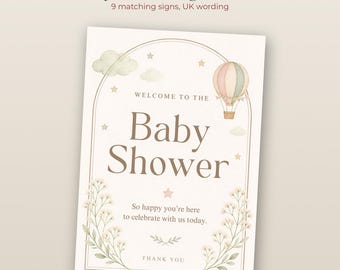 May include: A rectangular baby shower sign featuring a watercolor hot air balloon, clouds, and stars within an arched frame. The text reads: Welcome to the Baby Shower, So happy you're here to celebrate with us today, and Thank You.