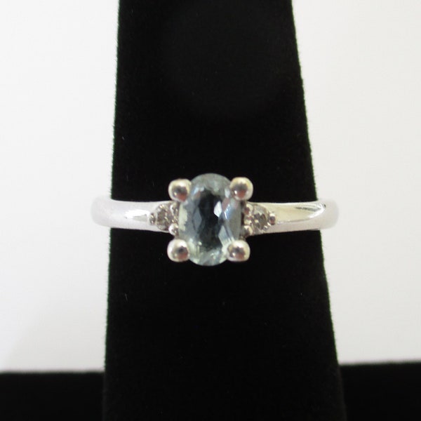 A 9 carat 9ct white gold real diamond and blue topaz or aquamarine ring 2.09 grams approx. size UK N.50 or USA 7