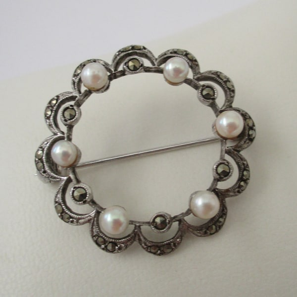 A sterling silver hallmarked mid 20th century vintage marcasite and faux pearl brooch pin