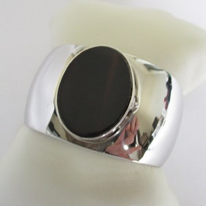 A large Celia Sebiri cuff bangle bracelet Princess Marcella Borghese makeup bracelet