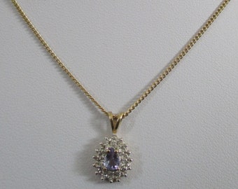 A 9 carat 9ct yellow gold stamped 375 genuine diamond and amethyst pendant charm on 9 carat chain necklace 3.34 grams