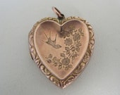 A Victorian 9ct 9 carat rose gold Back Front antique heart shaped locket with bird and floral engraving