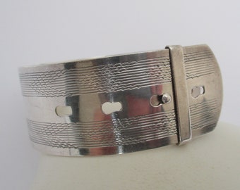 A sterling silver vintage adjustable buckle or belt style bangle bracelet 30.18  grams