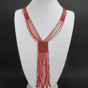 A Victorian or Edwardian antique cut steel and red glass woven beadwork