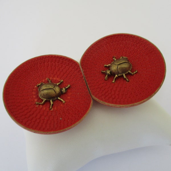 An Art Deco era ladybird ladybug belt buckle slides made from dyed red wood