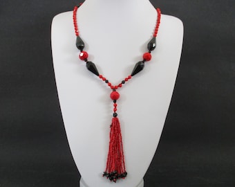An Art Deco style black and red glass bead tassel Flapper style necklace approx. 72 cm or 28 inches