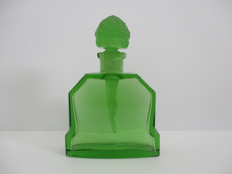An Art Deco Heinrich Hoffman 1926 Czech green glass nude dauber An Art Deco Heinrich Hoffman 1926 Czech green glass nude dauber