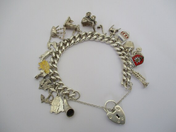 A sterling silver charm bracelet solid heavy curb link charm