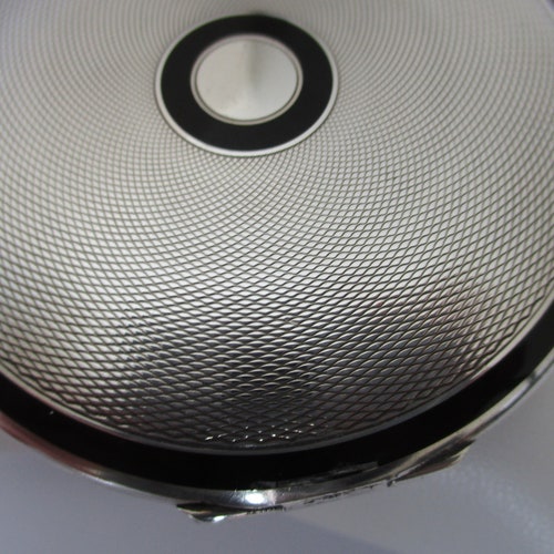 A sterling silver Art Deco hallmarked London 1935 C&C Cohen and Charles shops powder compact with black enamel decoration 74.7 grams