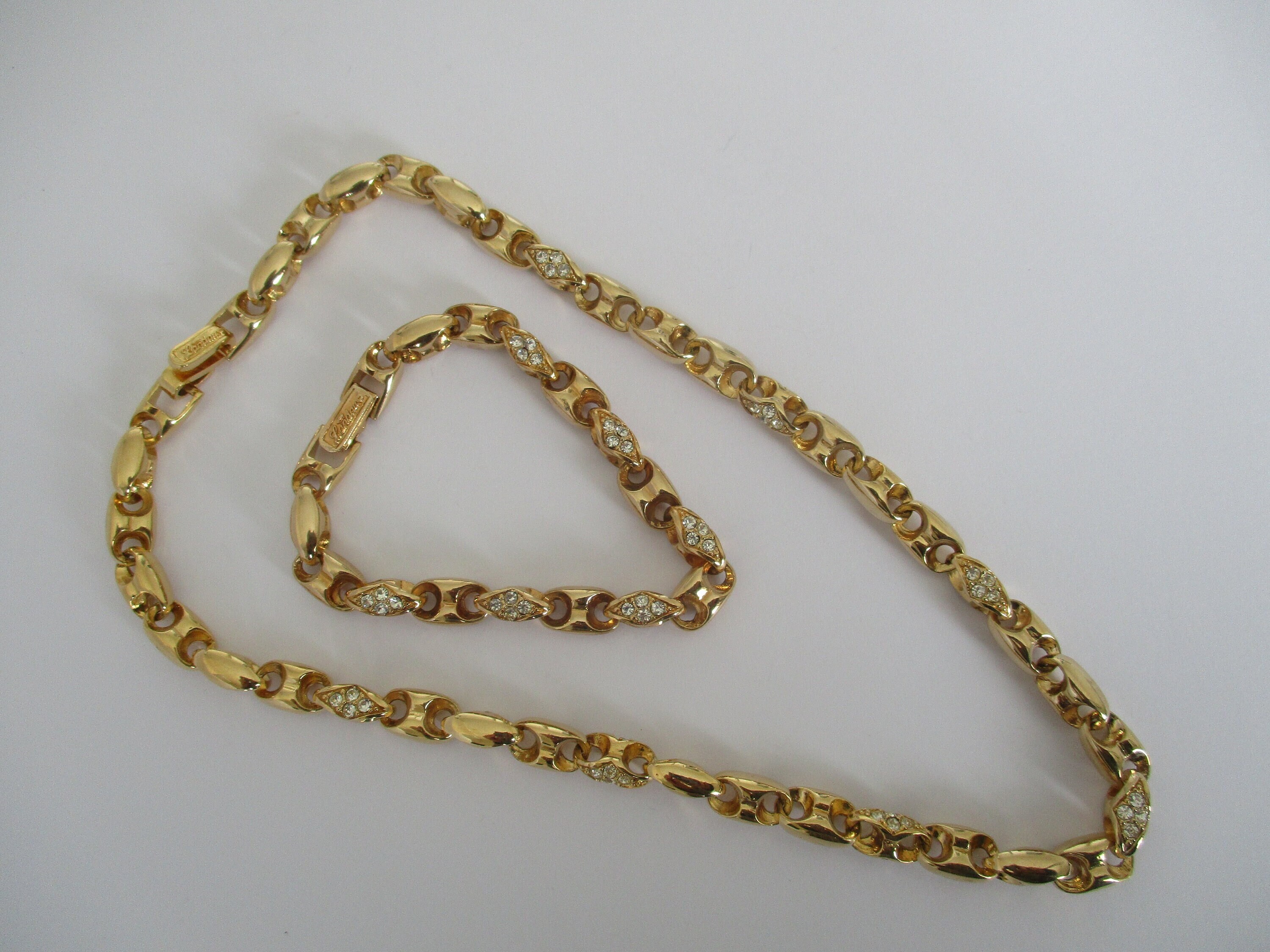 A Landau Gold Tone Crystal Set Anchor Necklace and Bracelet Set
