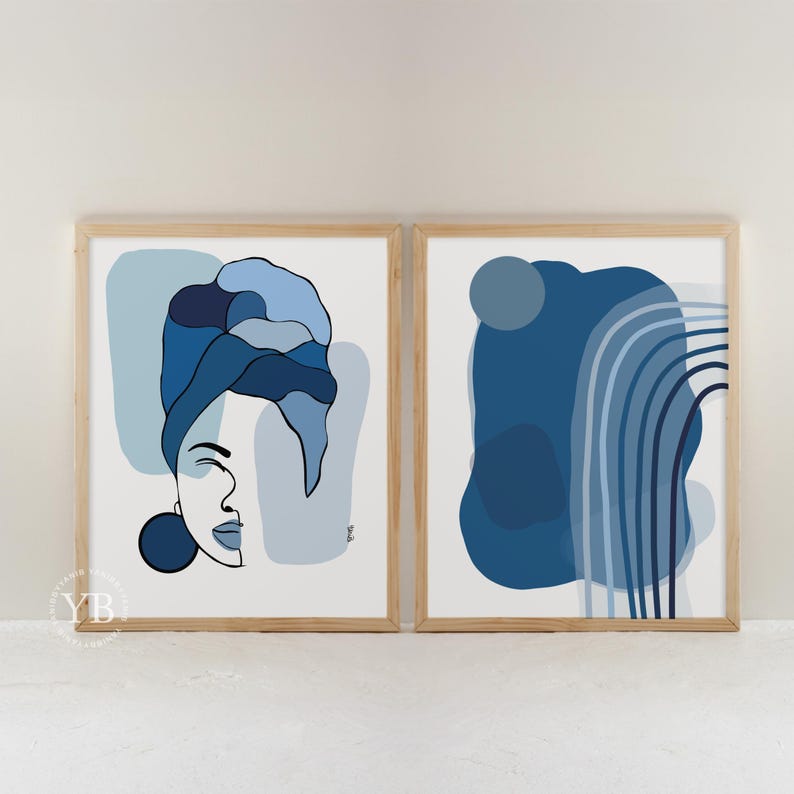 two framed artworks with abstract blue designs. The artworks are displayed side by side on a white wall, creating a visually appealing contrast between the two pieces.