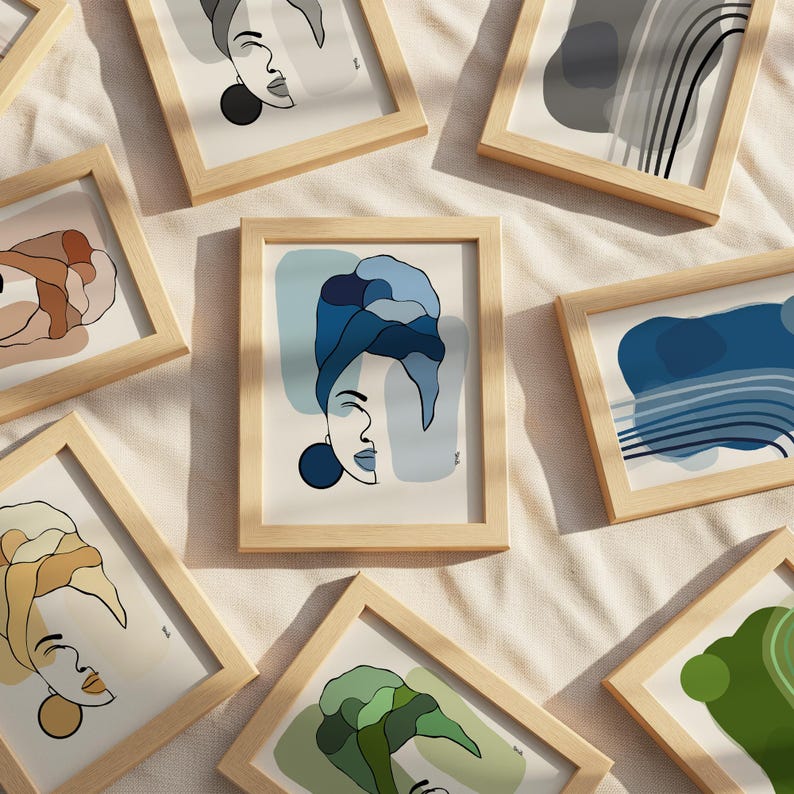 a collection of framed artworks featuring abstract illustrations of faces and nature.