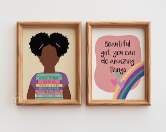 May include: Two framed art prints. One features a silhouette of a girl holding books with text: "I CAN BE ANYTHING, DREAM BIG, SPARKLE & SHINE, YOU ARE SEEN, YOU ARE LOVED." The other print says "Beautiful girl, you can do amazing things" with a rainbow.