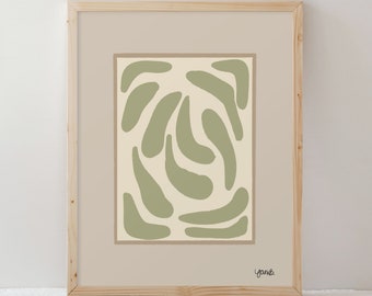 May include: A framed print with a green abstract design of curved shapes on a cream background. The print is signed "yoniB" in the bottom right corner.