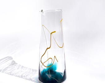 Hand-Blown Lagoon Glass Pitcher: Sleek Carafe