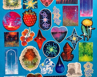 May include: A collection of various stickers featuring diverse designs including landscapes, celestial patterns, floral motifs, geometric shapes, hearts, and abstract art in vibrant colors like red, blue, green, and yellow on a solid blue background.