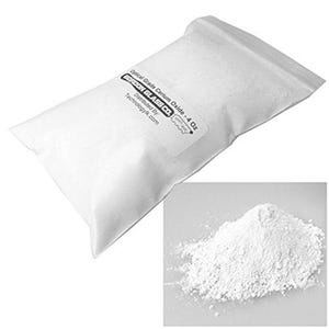 May include: A white bag containing 4 ounces of optical grade cerium oxide powder. The bag is labeled "Optical Grade Cerium Oxide - 4 Oz" and "Gordon Glass Co."