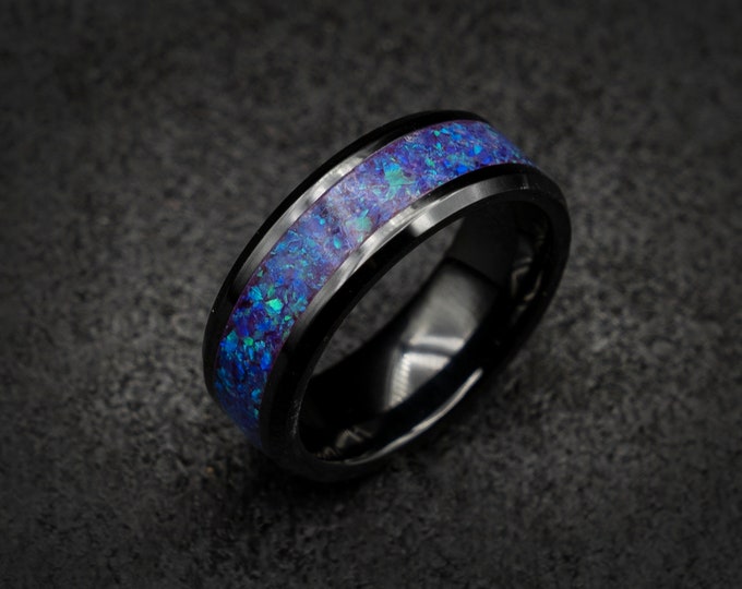 Black ceramic ring with crushed opal.