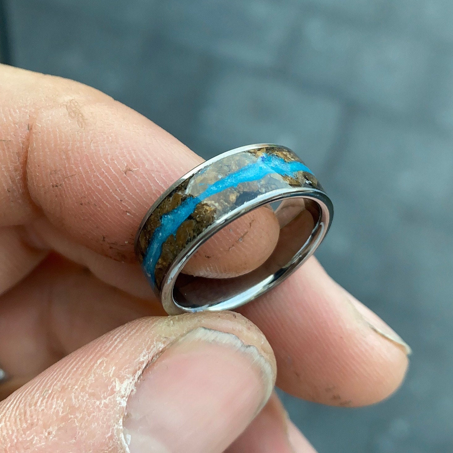 Glow in the dark. Tungsten opal ring with Petrified wood