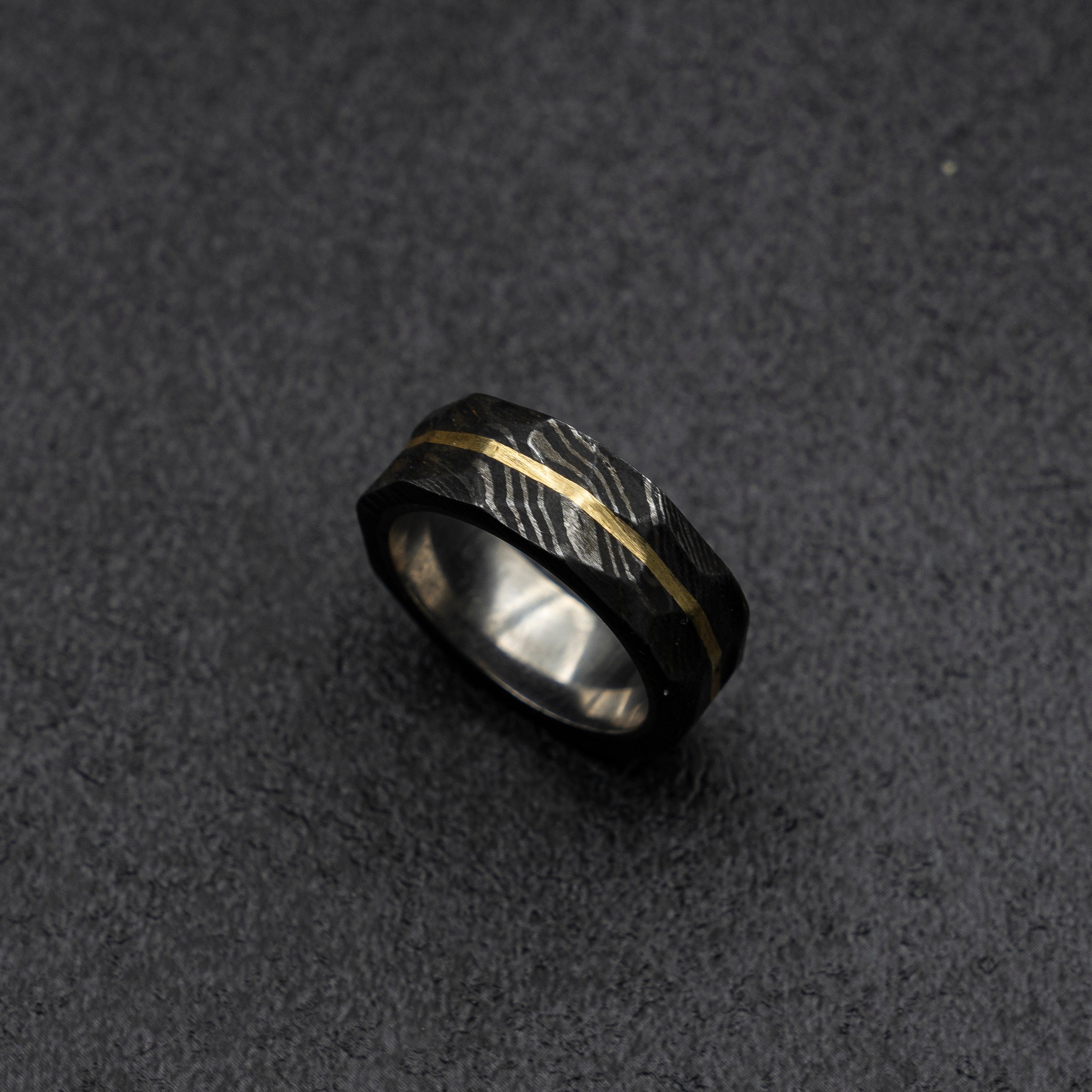 Close-up of Wedding Rings Lying on a Piece of Wood · Free Stock Photo