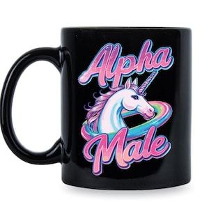 May include: Black ceramic mug with a white unicorn with a rainbow behind it and the text "Alpha Male" in pink and blue letters.