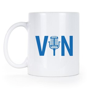 May include: White ceramic mug with a blue microphone graphic and the text "VIN" printed on the side.