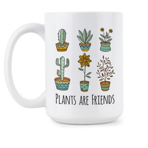 May include: White ceramic mug with a black outline of various potted plants and the text "Plants are friends".