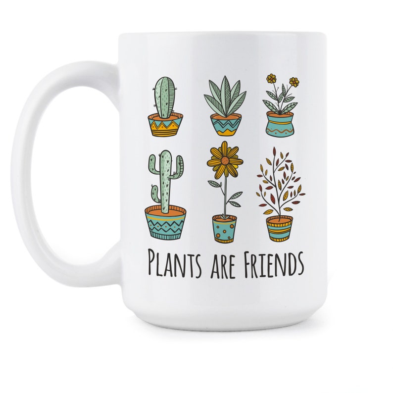 May include: White ceramic mug with a black outline of various potted plants and the text "Plants are friends".