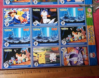 Vintage Burger King Pokemon 1st Movie Card Sheets 12 and 16 Master Trainer  Collector Set Uncut 1999