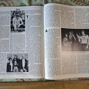 May include: A vintage magazine spread featuring articles and photographs. The page is open, displaying text and black and white images. The headline "Sport" is visible at the top. The images include a young boy and a group of people.