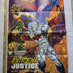May include: A folded comic book poster featuring the title "Extreme Justice" with various superhero characters in action poses. The poster has a vibrant color palette with text that reads "Extreme Crimes Call For Extreme Justice."