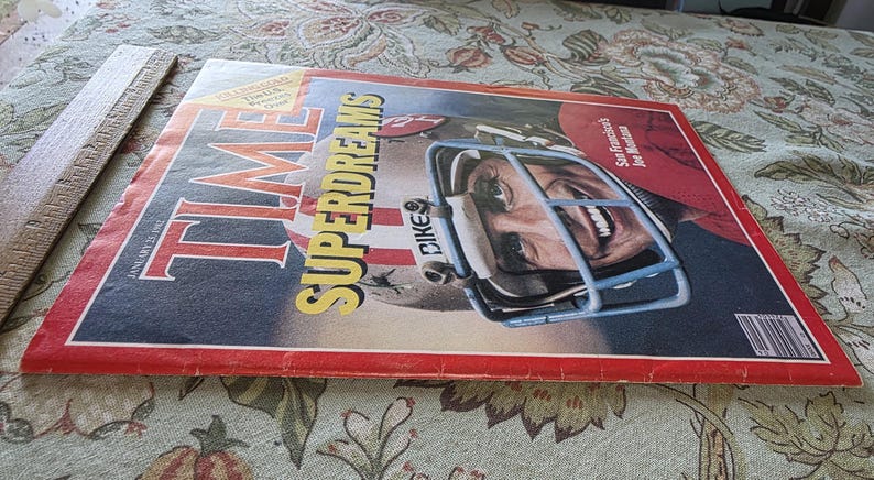 May include: A vintage January 1982 TIME magazine cover featuring a football player in a helmet. The cover has the headline "SUPERDREAMS" in yellow and the player's face is visible through the helmet's face mask. The magazine has a red border.