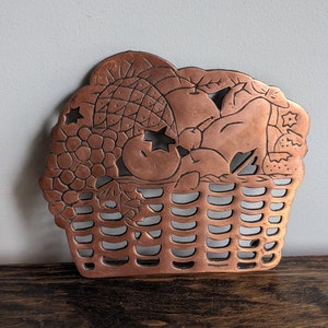 Copper and cast iron kitchen trivet