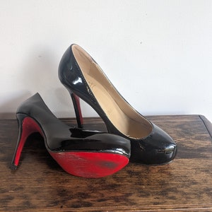 Christian Louboutin black patent leather red bottom pumps