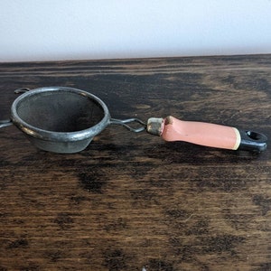Vintage small wooden handle strainer